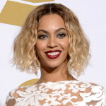 FILE - This Jan. 26, 2014 file photo shows Beyonce at the 56th annual Grammy Awards in Los Angeles. The Department of Women's and Gender Studies at Rutgers University is offering a course called "Politicizing Beyonce." Kevin Allred, a doctoral student who is teaching the class, tells the university's online news site that he is using her career as a way to explore American race, gender and sexual politics. The class supplements an analysis of her videos and lyrics with readings from Black feminists. (Photo by Dan Steinberg/Invision/AP, FIle)
